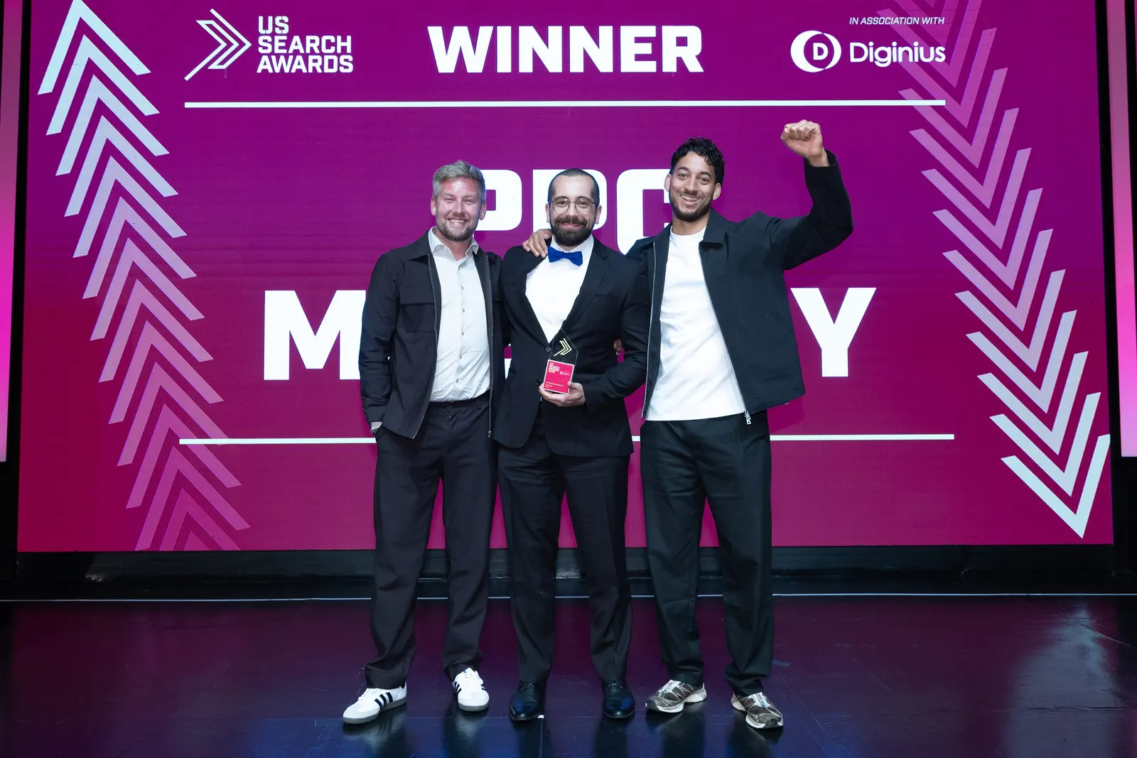 The PPC OS team on stage with the trophy for Best Search Software Tool at the US Search Awards 2026 in New York